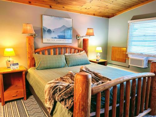a bedroom with a bed with a wooden bed frame at NewVida Preserve in Wilmington