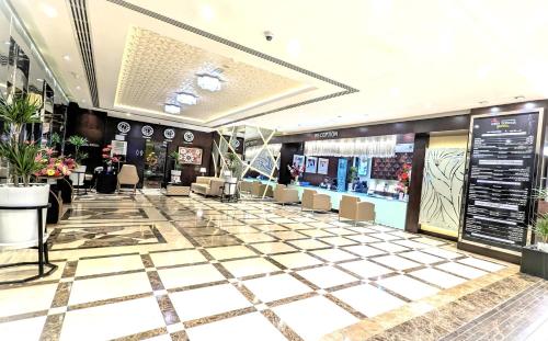 a shopping mall with a checkered floor at City Tower Hotel in Fujairah