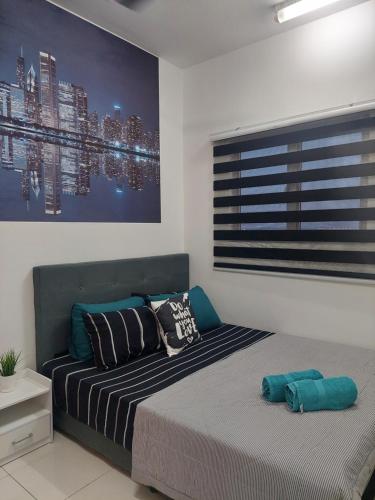 a bedroom with a bed and a painting on the wall at KLIA Travel Homestay - 3R 2B - WIFI & NETFLIX in Sepang