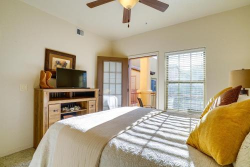 a bedroom with a large bed and a television at Inviting Las Cruces Condo Less Than 1 Mi to Mesilla Plaza! in Las Cruces