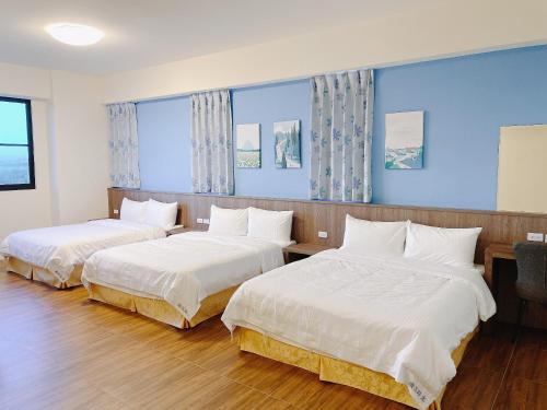 Postel nebo postele na pokoji v ubytování 漫活時光民宿 Leisure Living