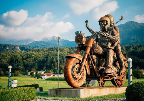 a statue of a man riding a motorcycle at Apartment Sommer am Faaker See in Faak am See