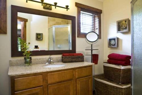 a bathroom with a sink and a mirror at Whiteface Mtn. Winter Adventure Getaway in Wilmington