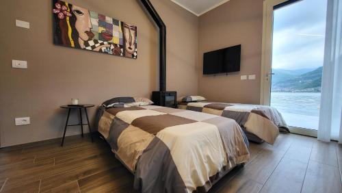 Giường trong phòng chung tại COSTA PARADISE