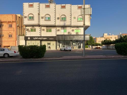 a building with a car parked in front of a street at بيت المصيف in Taif