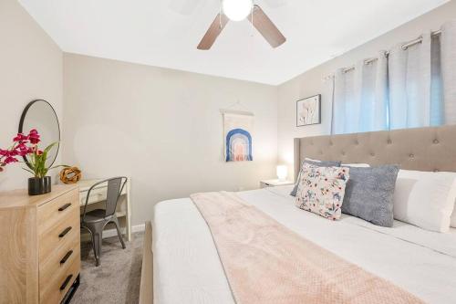 a bedroom with a bed with a dresser and a desk at * Lux Modern Retreat * Downtown * King Beds * in Durham