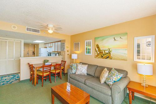 a living room with a couch and a table at Spacious Oceanfront 2 Bedroom Suite - Sleeps 8! - Roxanne Towers Unit 406 in Myrtle Beach
