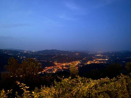 a view of a city at night at Lo Scoiattolo Country House in Montorio al Vomano