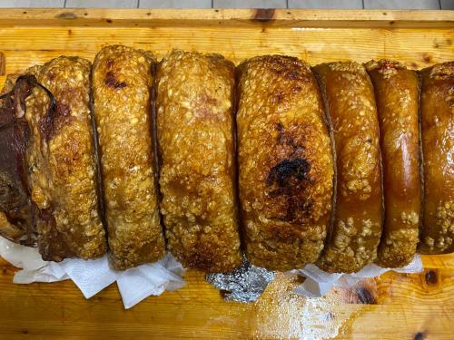 a group of food sitting on a wooden cutting board at Lo Scoiattolo Country House in Montorio al Vomano