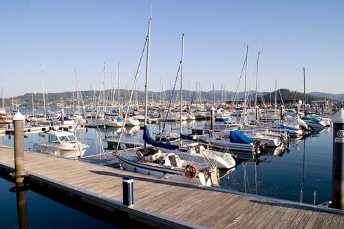 a bunch of boats docked in a marina at Hotel Xeito in Combarro