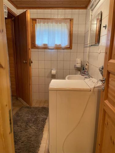 a small bathroom with a sink and a mirror at Ylläs Seita cottage in Kittilä