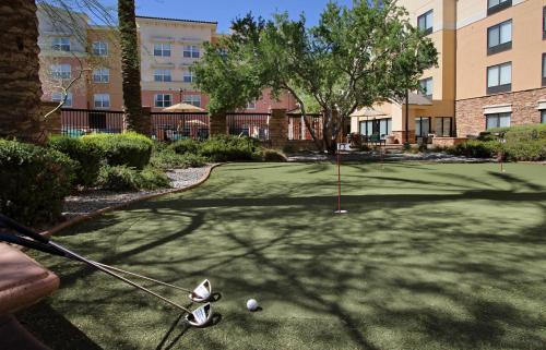 a golf course in a apartment complex with a putting greens at SpringHill Suites Phoenix Glendale Sports & Entertainment District in Glendale