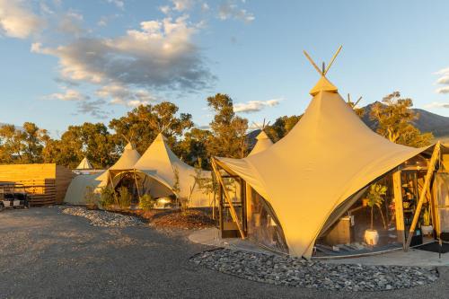 a group of tents parked in a parking lot at Under Canvas North Yellowstone - Paradise Valley in Livingston