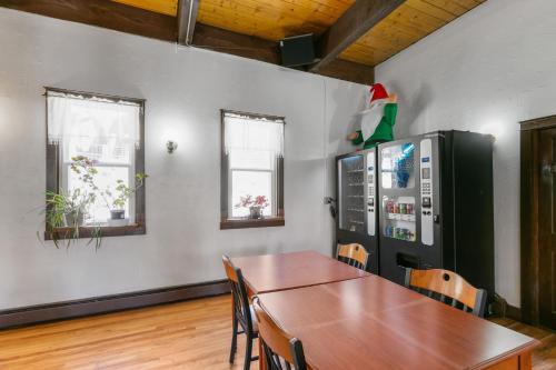 a dining room with a table and a refrigerator at Georgetown Lodge in Georgetown