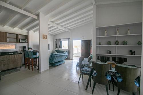 a living room with a couch and a table and chairs at Casa Bita Morales CASA 201 in Cartagena de Indias