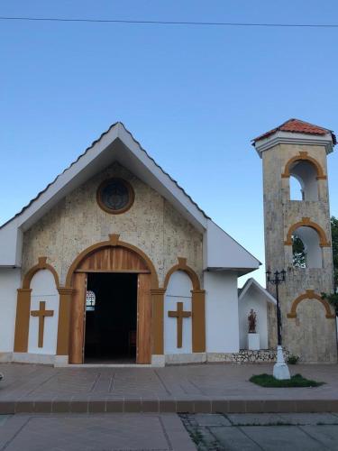 a church with a large door and a tower at Casa Bita Morales CASA 201 in Cartagena de Indias