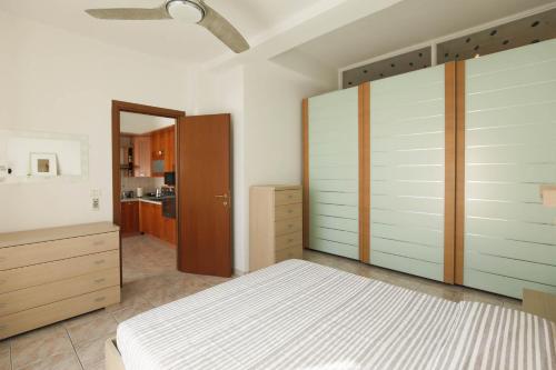 a bedroom with a bed and a large closet at Casa Saffi in Livorno