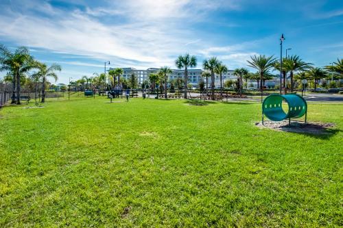 a park with a green object in the grass at 2971 Castaway Lane in Orlando