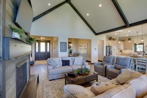 a large living room with couches and a fireplace at South Dakota Retreat with Hot Tub, Fire Pit and Grill! in Spearfish