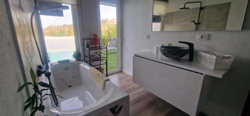 a bathroom with a sink and a large window at El refugio los portales in Arucas