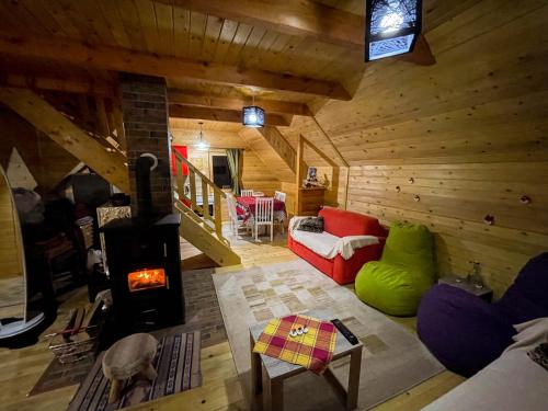 an overhead view of a living room with a wood stove at Cozy Cabin in the Woods in Brezovica