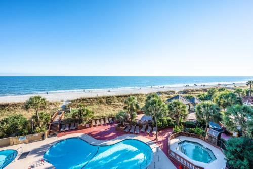 an aerial view of a resort with two pools and the beach at Resort condo w balcony & hot tubs in Myrtle Beach