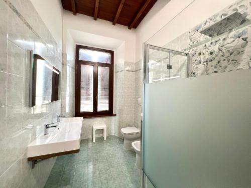 a bathroom with a sink and a toilet and a shower at Sealovers house in Civitavecchia