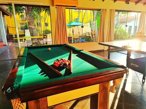 a pool table with a ball on top of it at POUSADA EVELINA in Foz do Iguaçu
