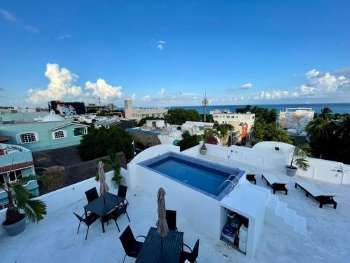 a swimming pool on the roof of a house at MAYAB Playa - 5Th. Ave in Playa del Carmen