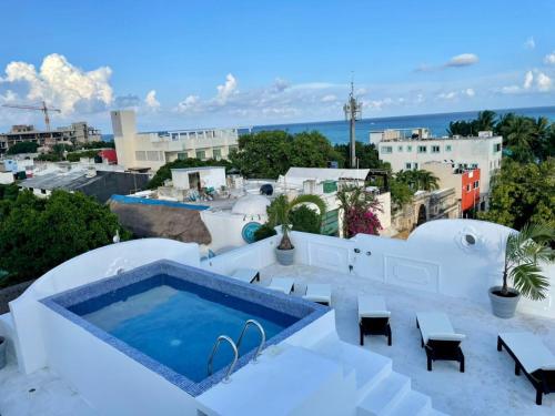 a swimming pool on the roof of a house at MAYAB Playa - 5Th. Ave in Playa del Carmen