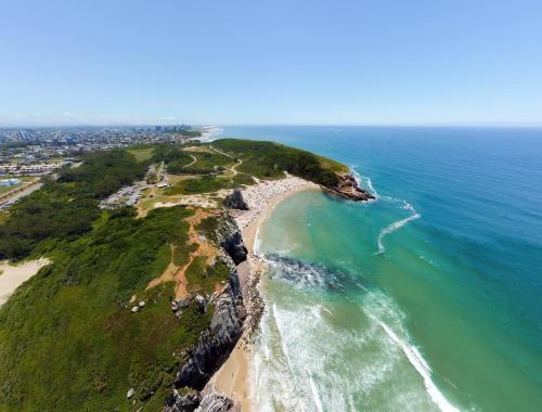an aerial view of a beach and the ocean at Farol Hotel in Torres