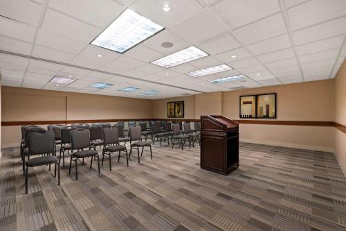 a conference room with chairs and a podium in it at Best Western Plus Orangeville Inn & Suites in Orangeville