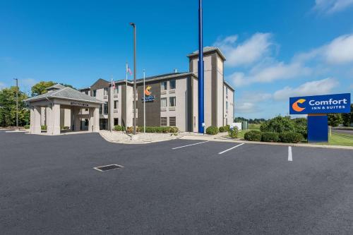 a building with a sign in front of a parking lot at Comfort Inn & Suites Tipp City Dayton North I-75 in Tipp City