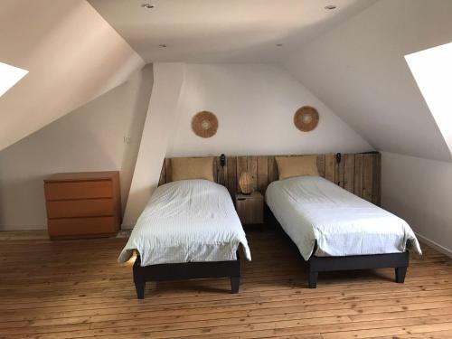 Postel nebo postele na pokoji v ubytování Le saint Pierre