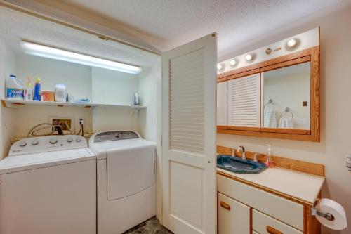 a laundry room with a washing machine and a sink at Ski-in Condo with Hot Tub on Burke Mtn Slopes! in East Burke