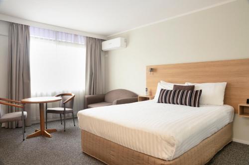 Postel nebo postele na pokoji v ubytování Posthouse Motor Lodge