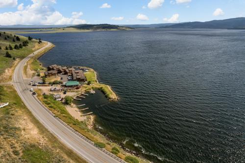 an aerial view of a lake and a road at King's Cabin in West Yellowstone