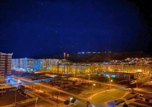 a city at night with buildings and street lights at CHIC & COSY appartement trés calme in Agadir