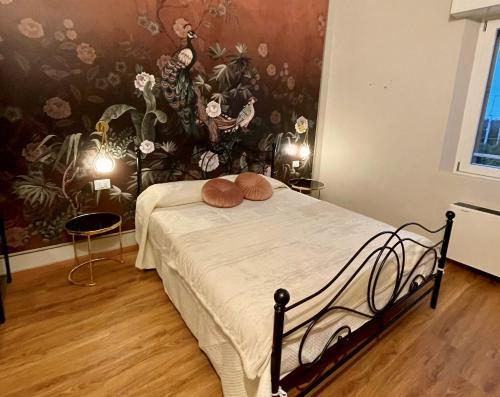 a bedroom with a bed with two pillows on it at Domus 44 Rooms - Porta Nuova in Verona