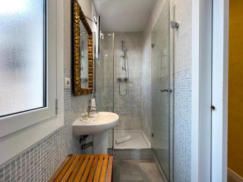 a bathroom with a sink and a shower and a toilet at Stay U-nique Apartments Fontrodona in Barcelona