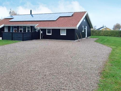 a house with a lot of solar panels on it at 12 person holiday home in Nordborg in Nordborg