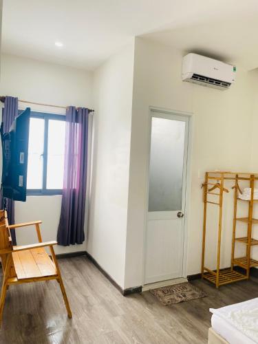 a room with a door and a window at Homestay KV in Can Tho