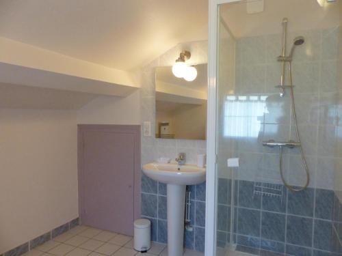 a bathroom with a sink and a shower at Gîte Abrest, 5 pièces, 8 personnes - FR-1-489-386 in Abrest