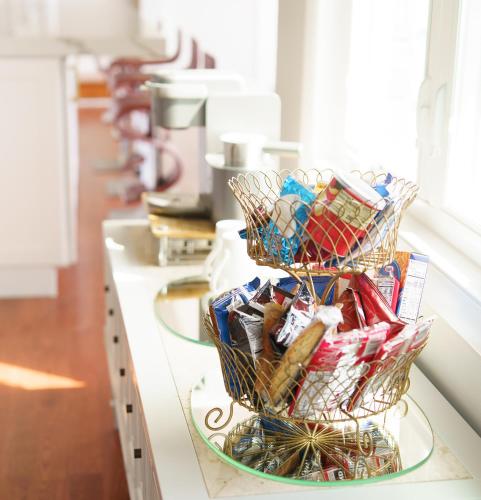 a counter with two baskets of candy on it at 2-Acre Highland Park Retreat with Heated Pool ~ 5* in Highland Park