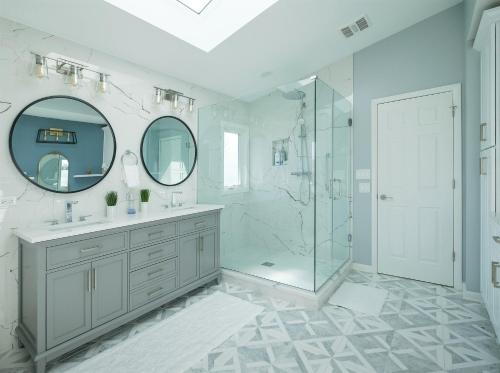 a white bathroom with a shower and a sink at 2-Acre Highland Park Retreat with Heated Pool ~ 5* in Highland Park