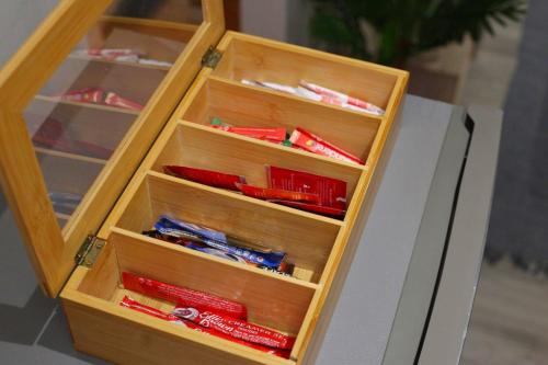 a wooden cabinet with drawers filled with toy trains at J$T Urban Bliss in Newton Park