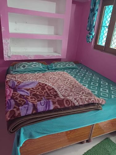 Krevet ili kreveti u jedinici u objektu Shri Kartikey Palace Homestay