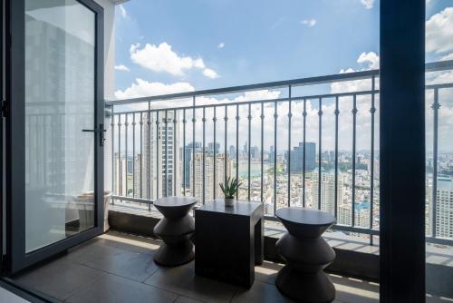 a balcony with two toilets and a view of the city at Vinhomes Central Park Apartments Luxury For Rent in Ho Chi Minh City