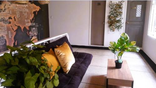 a living room with a couch and a table at DeRequka Hostel in Pereira