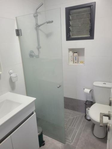 a bathroom with a shower and a toilet at Newly Renovated Home in Bet Shemesh Vatika in Beit Shemesh